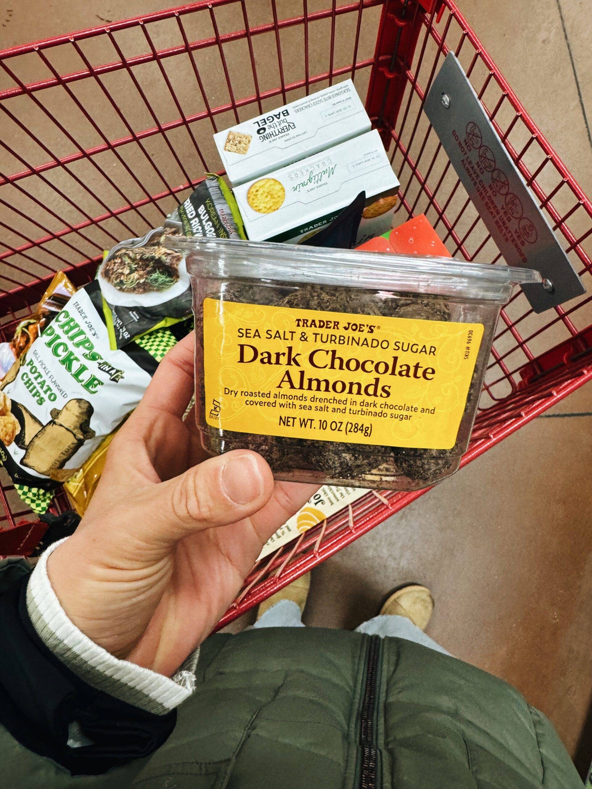 Sea salt turbinado dark chocolate almonds in a container.