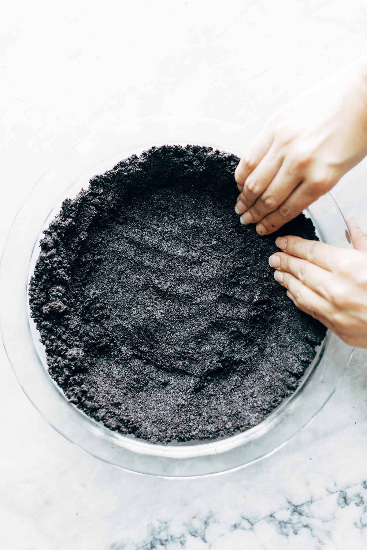 Pressing Mocha Peanut Butter Pie crust into pan.