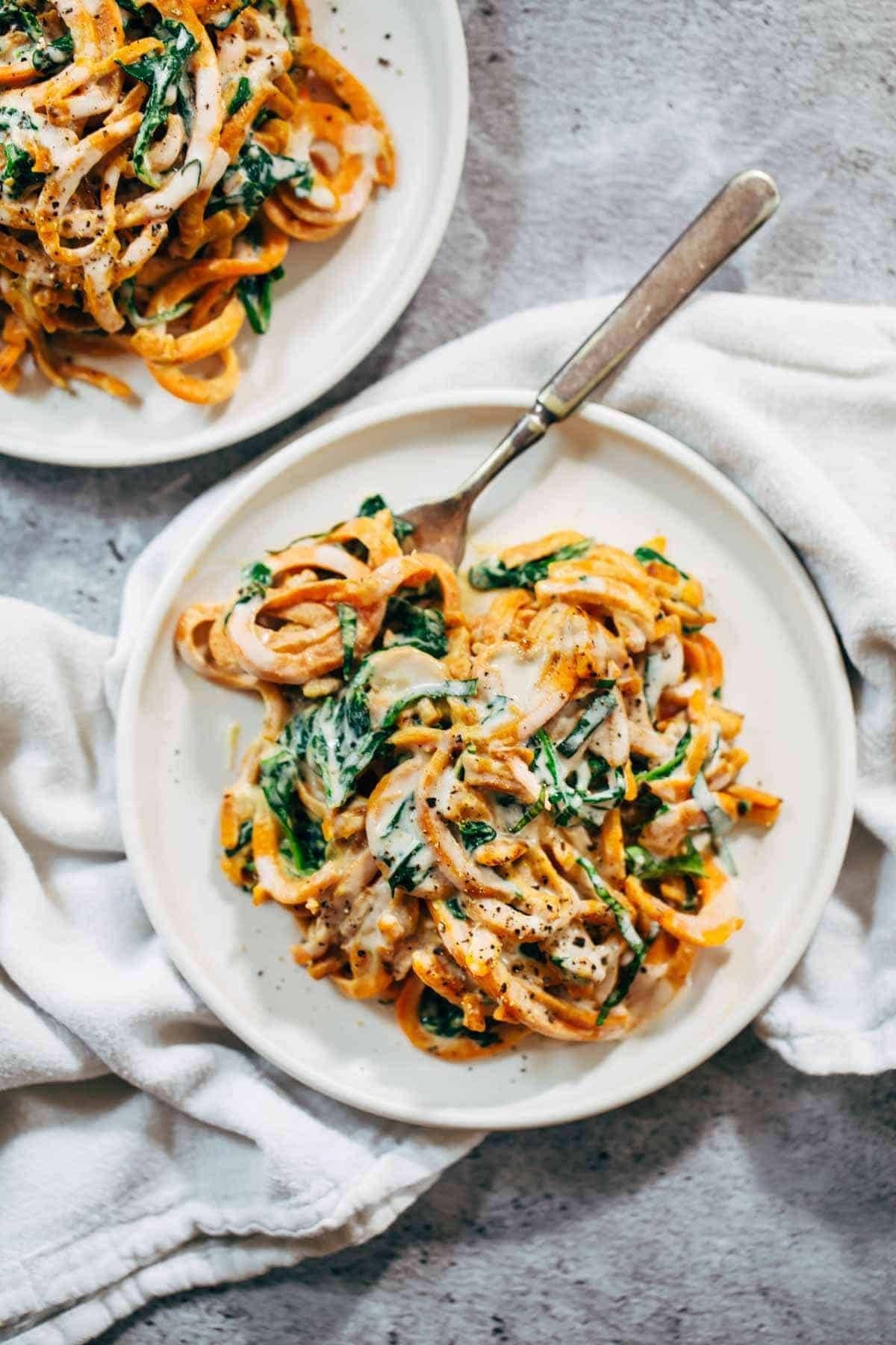Creamy Spinach and Sweet Potato Noodles with Cashew Sauce - easy to make, adaptable, gluten free, vegan. Devine and delicious! | pinchofyum.com