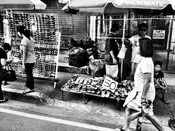 Black and white street with people.