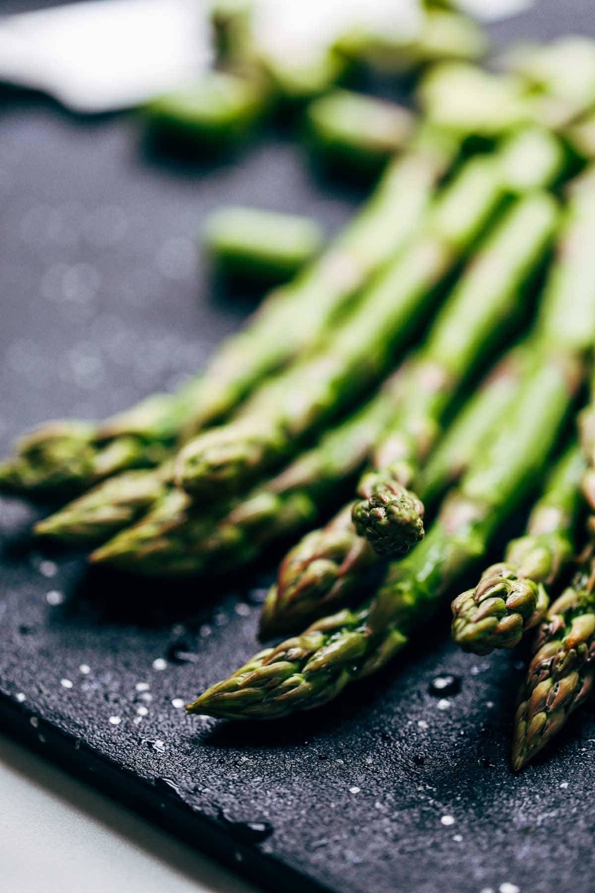 Asparagus on a cutting board.