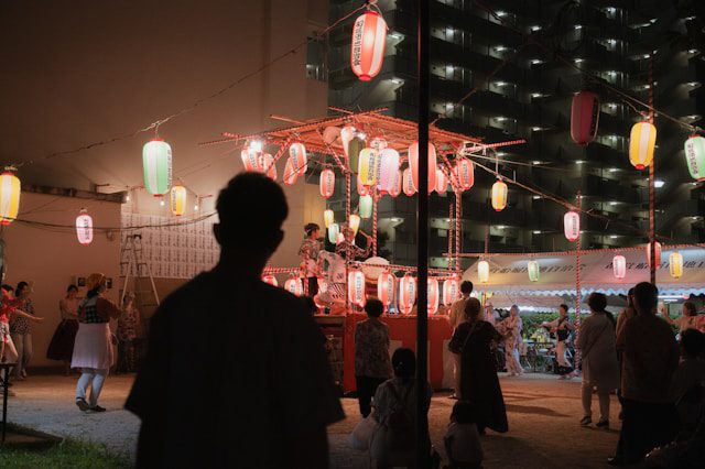 A stunning illuminated temple glowing against the night sky, casting a peaceful aura over the surroundings