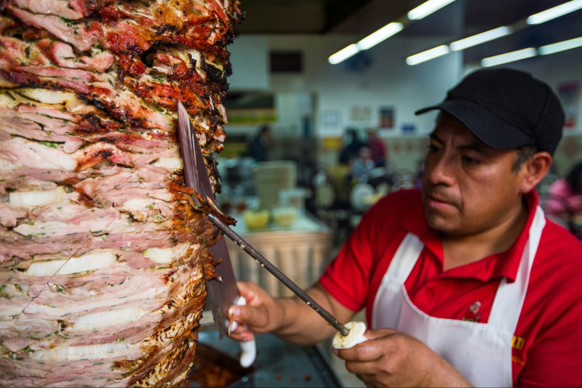 Man cutting yak meat