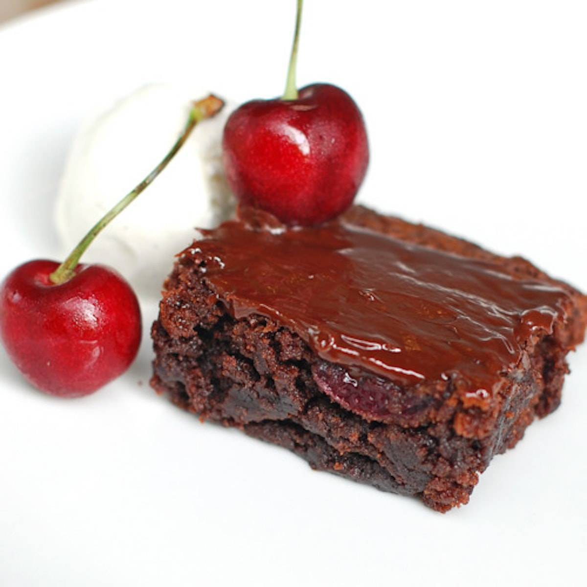 Roasted cherry brownie with ice cream and cherries.