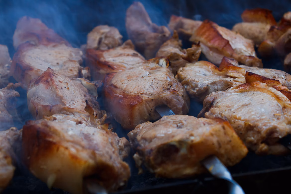 Grilled skewered BBQ meat, typically pork, lamb, or beef