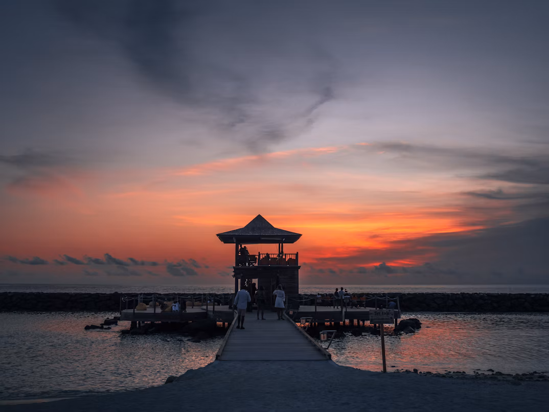 Winter sunset over Maldives ocean villas
