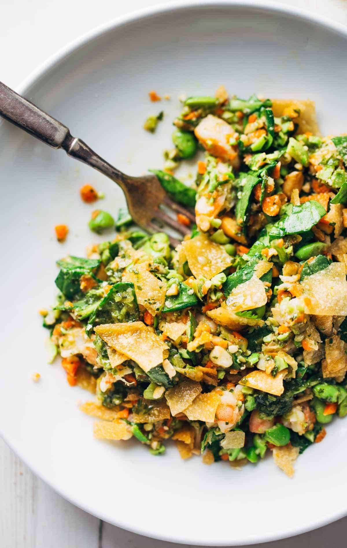 Salad topped with tortilla strips.