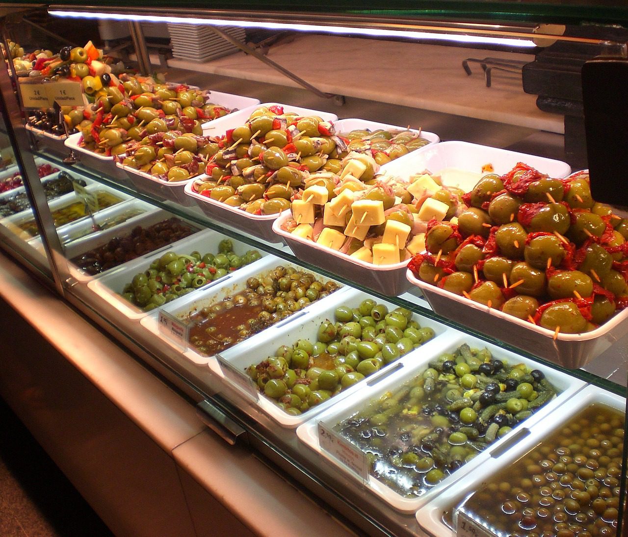 Food trays of olives, antipasti and tapas on display