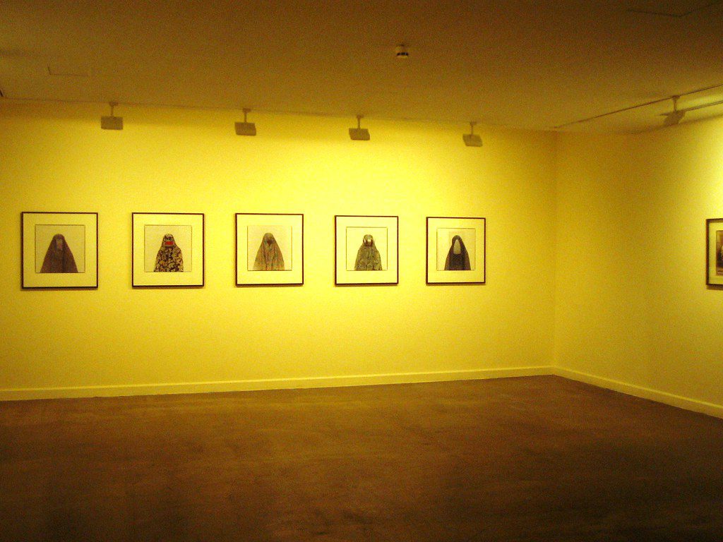 Paintings of Arab women inside the Sharjah Art Museum