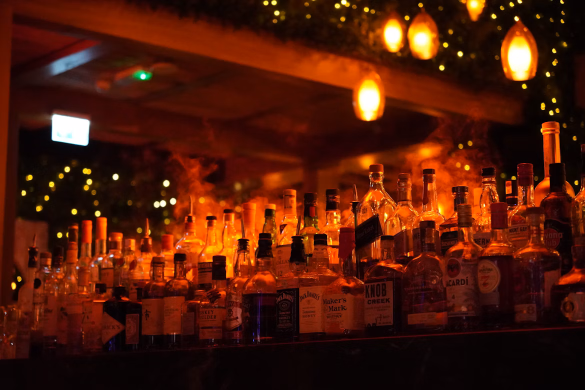 Bottles of Aged Scottish Whisky Displayed in a Distillery
